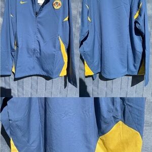 Nike Blue Jacket with Yellow and Red Emblem